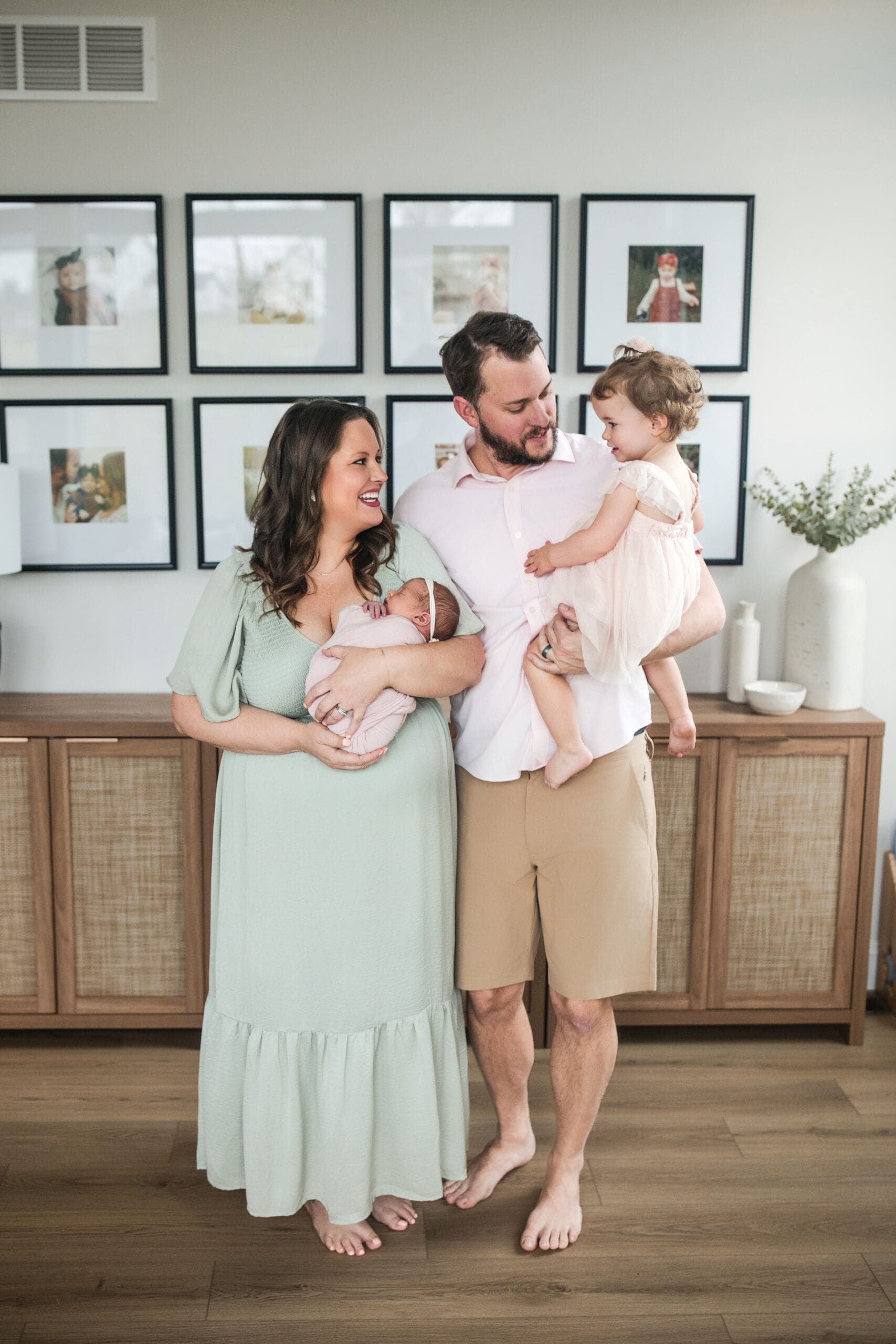 Family lifestyle photography at home in St Louis showing parents and children together in a cozy living room
