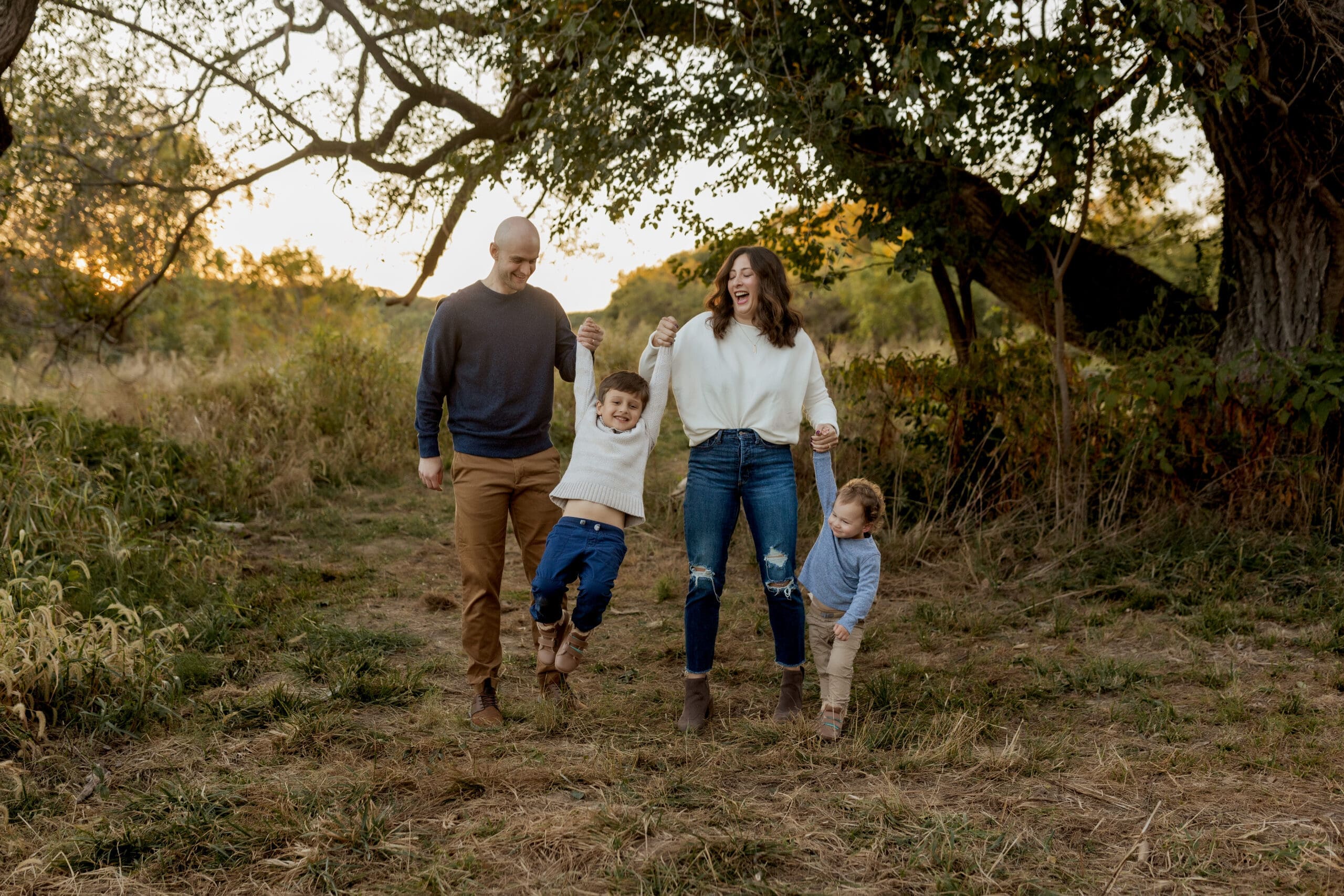 Family walking together during stress free family photos St Louis session