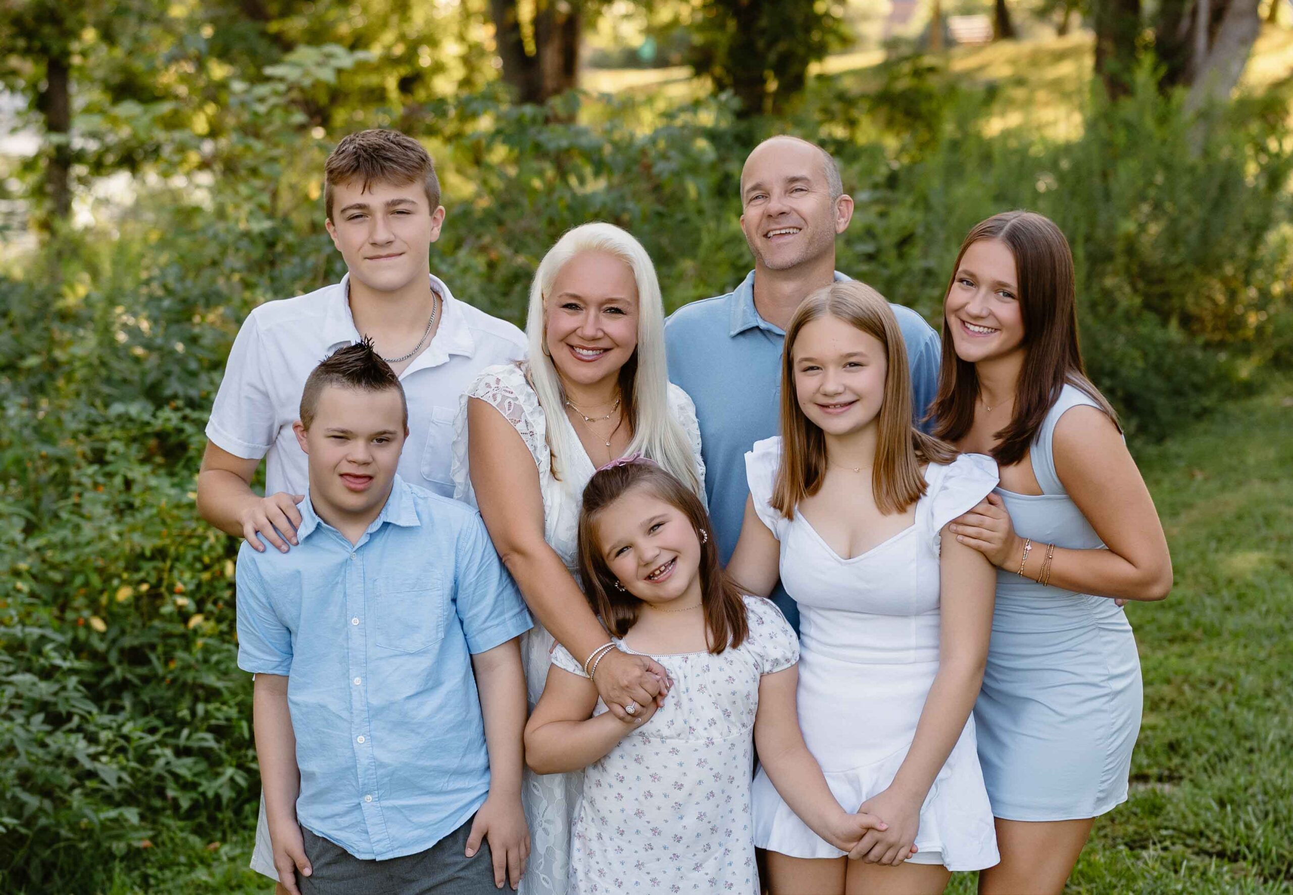 Family enjoying a natural outdoor photo session at Longview Farm Park in St. Louis, Missouri
